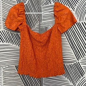 Express orange tank. Can be worn on or off the shoulder.